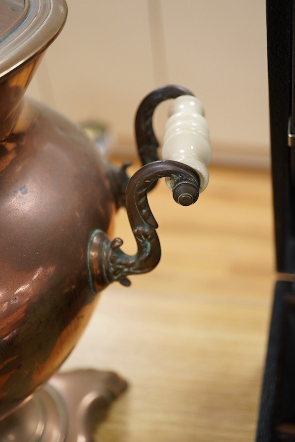 An early 20th century copper tea urn, 45cm. Condition- fair to good